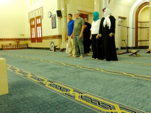 How to pray in a mosque. Everyone stands shoulder to shoulder between the 2 lines on the carpet and prays 